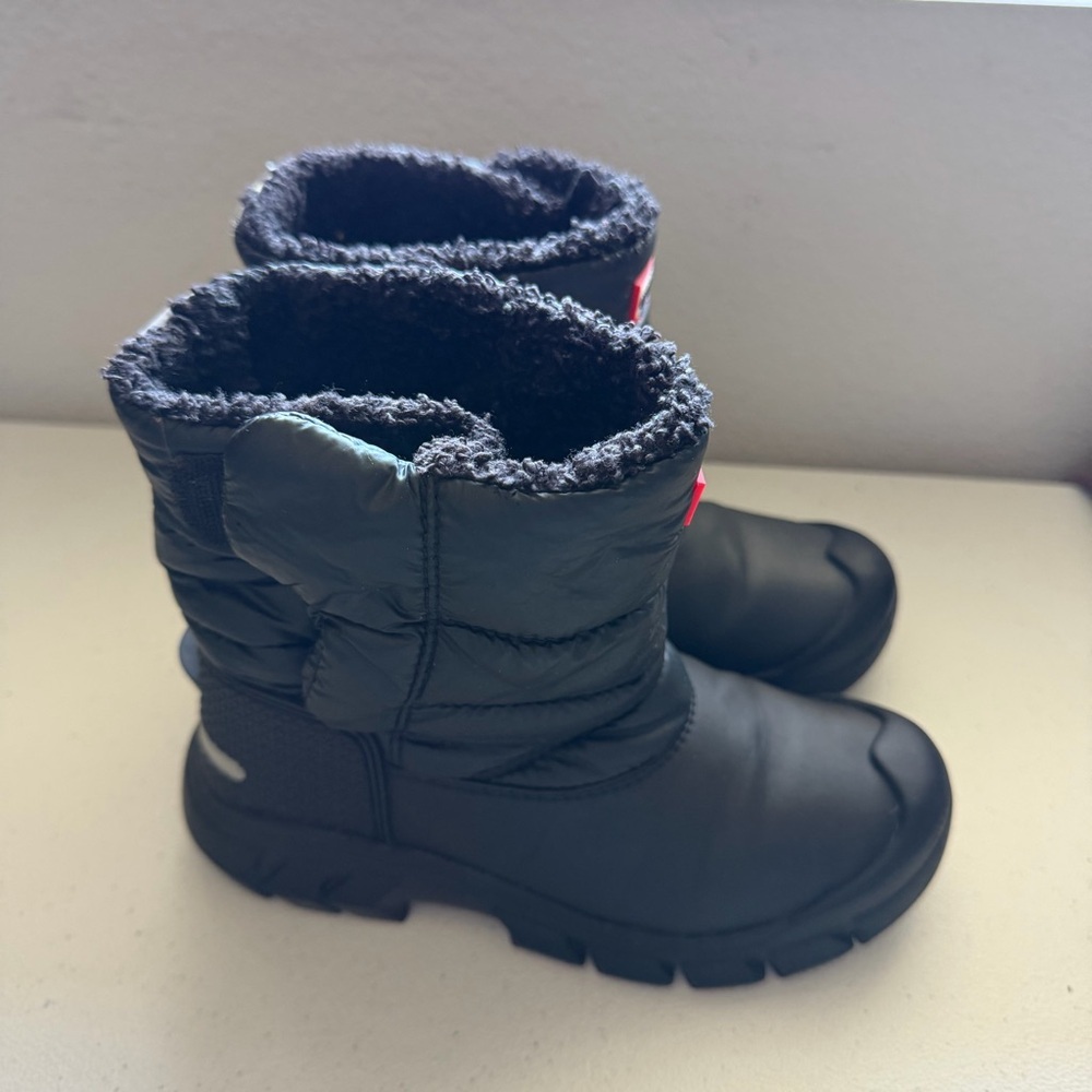 Hunter Kids' Intrepid Insulated Snow Boots in black.